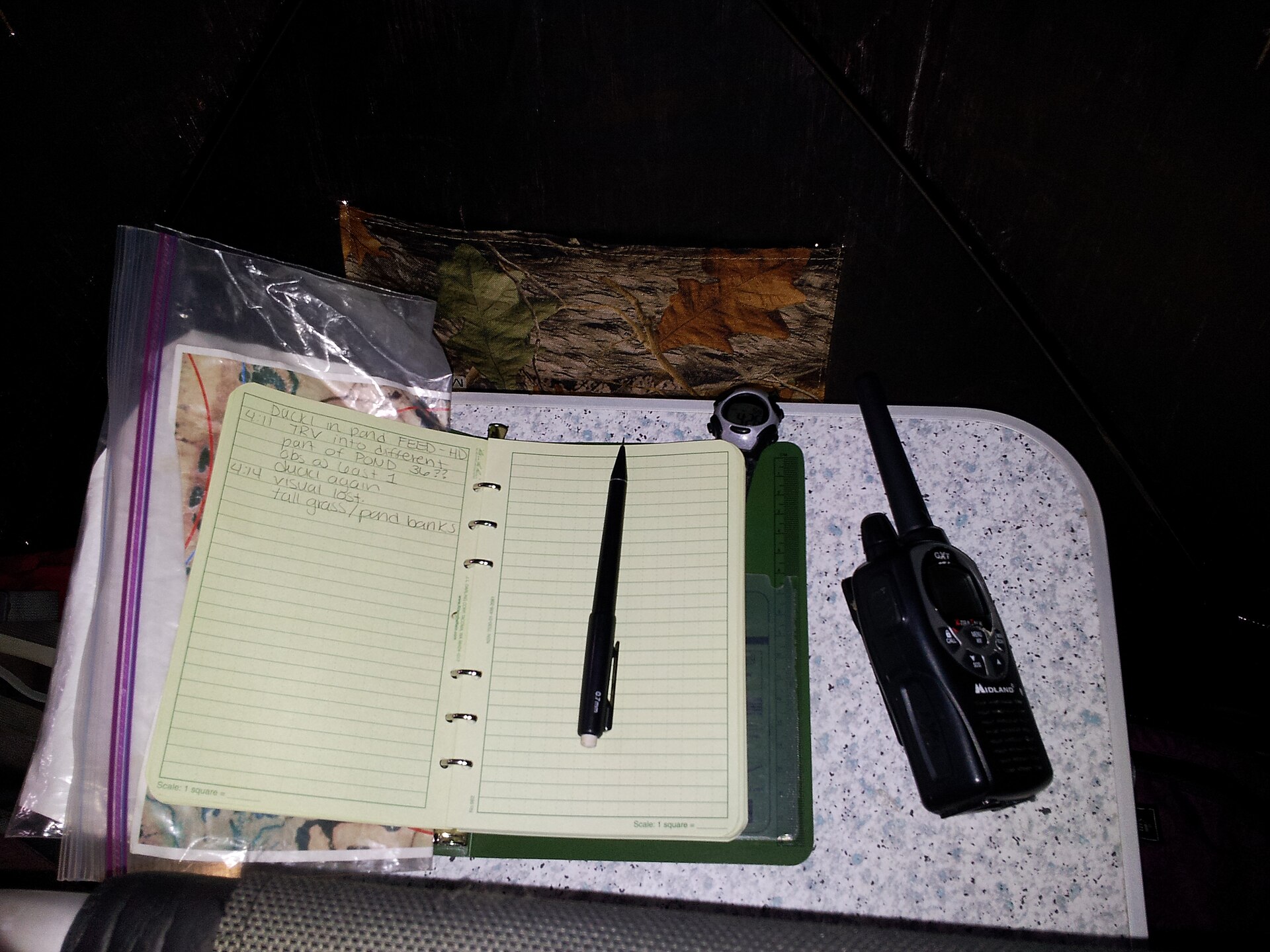 notebook checklist pen table